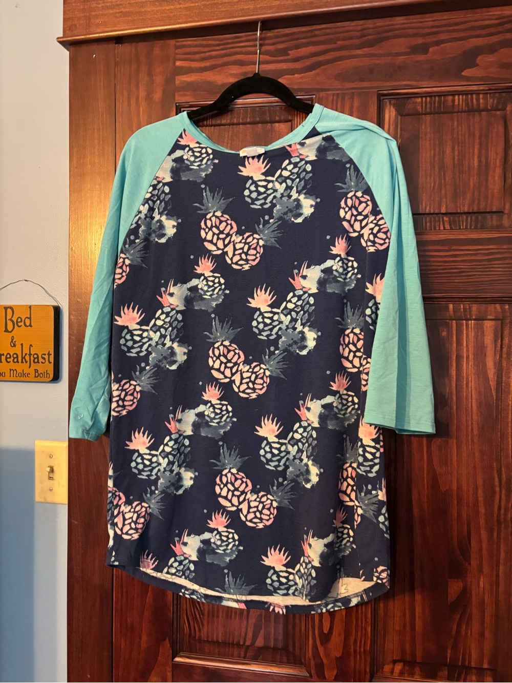 LuLaRoe Navy Pineapple Raglan Top with Aqua Sleeves